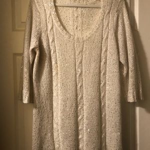 Maurice’s white sweater with small sequins dots all over.